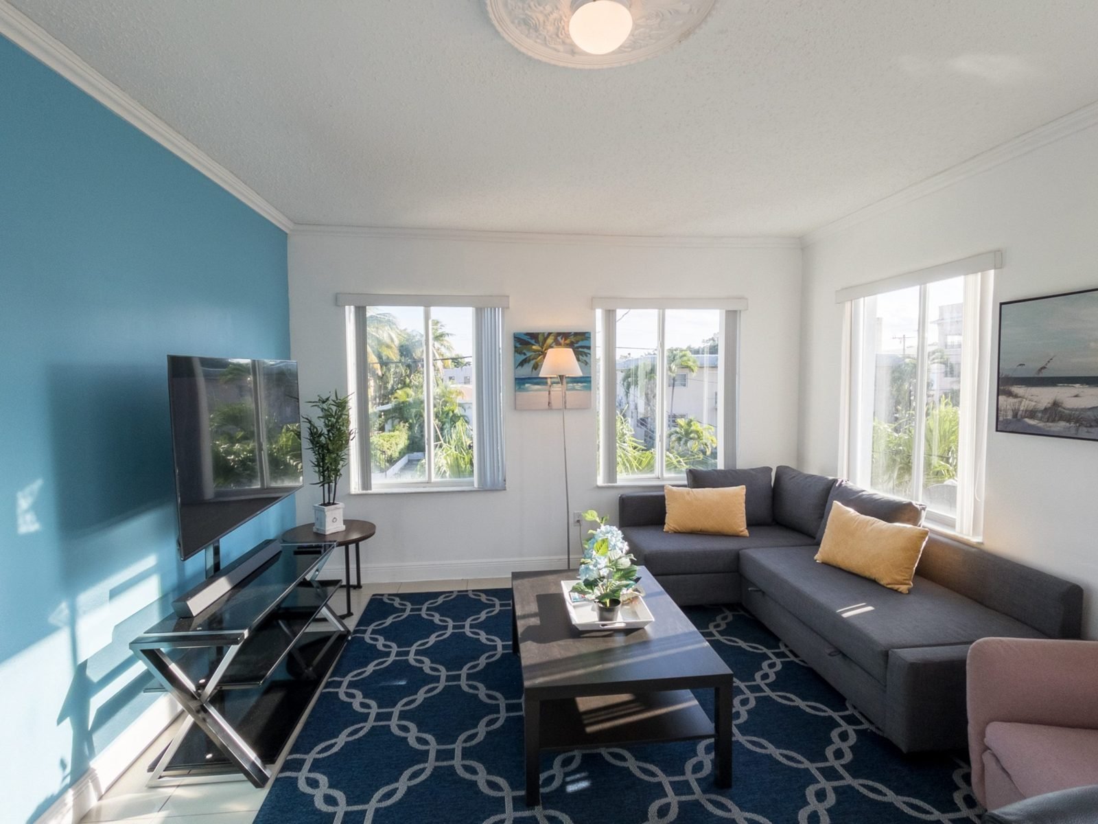 Living and dining room of the Cuba Libre Suite, furnished Miami apartment